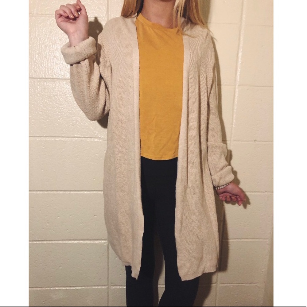 Long light tan cardigan sweater.